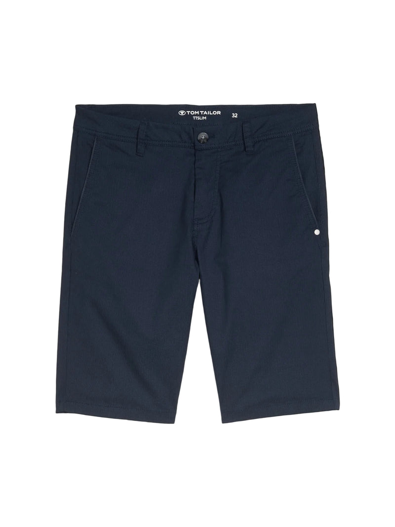 Navy shorts with a brand label on a black background